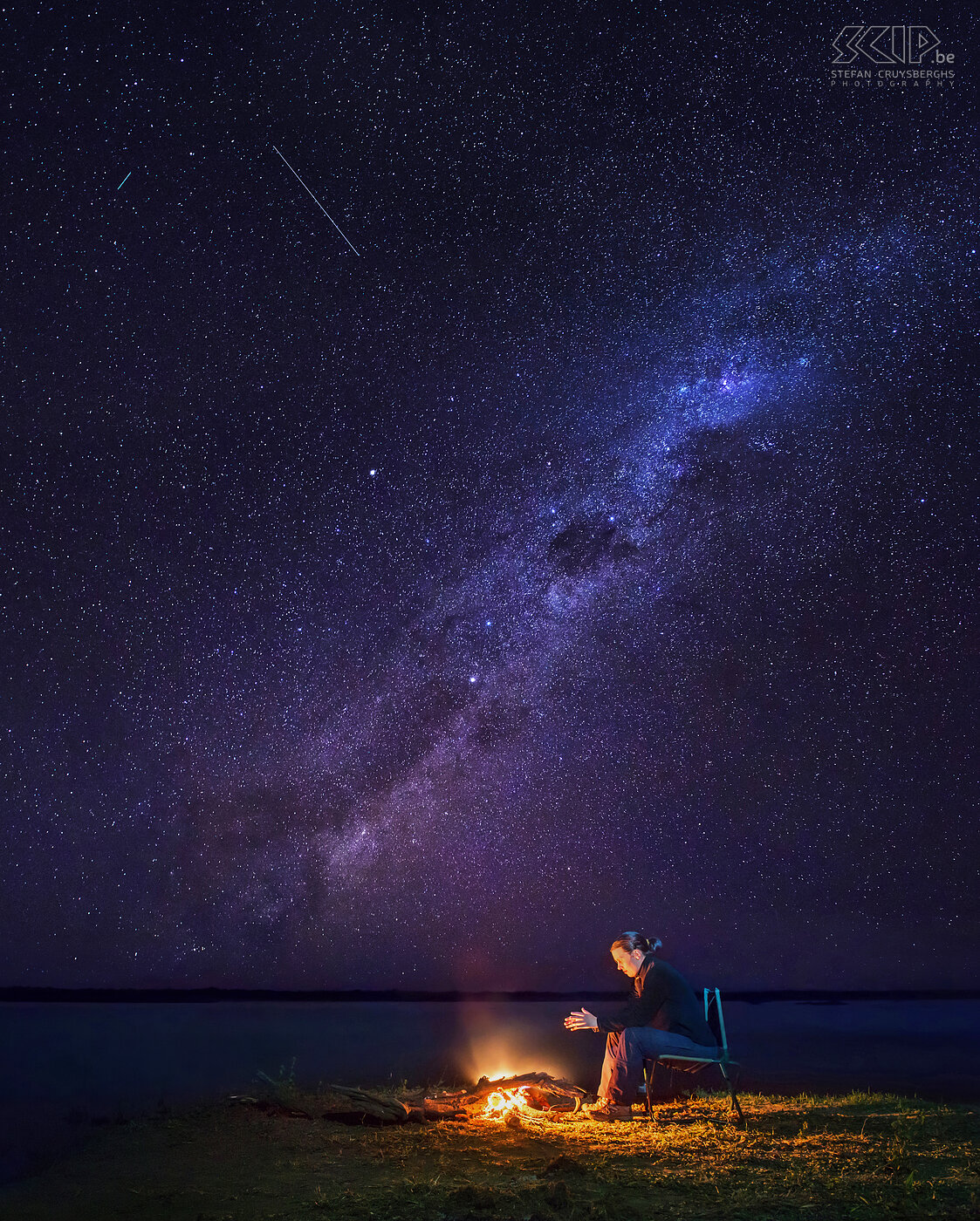 Lower Zambezi - Camp fire under milky way Again million stars and the Milky Way ware clearly visible. So I shot this panorama photo with in front my girlfriend at the campfire. Afterwards I noticed that my camera had also recorded two shooting stars in one of the photos. I assume that it quite unique to capture two shooting stars in 20 seconds. Stefan Cruysberghs